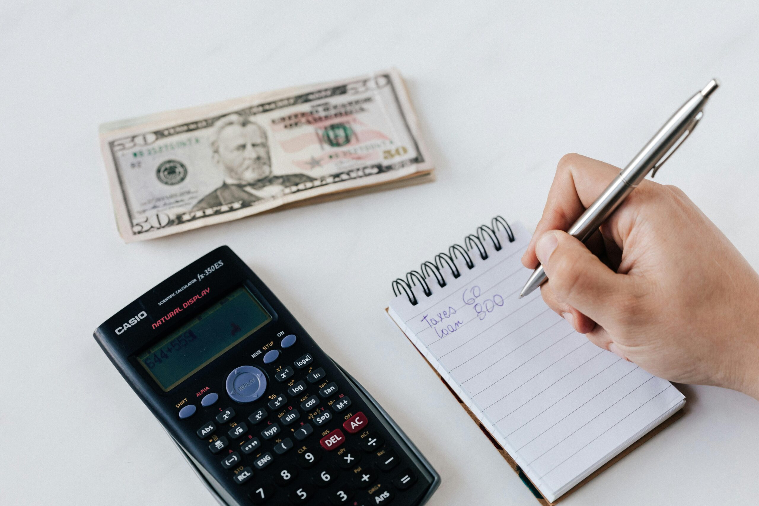 Person saving money in a jar, representing the 30-Day Money Savings Challenge with practical tips and financial discipline- Teluguways.com