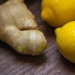 Cup of ginger tea with fresh ginger root, showcasing the health benefits of this natural remedy for digestion and overall wellness-Teluguways.com