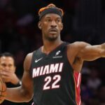 Jimmy Butler in a Golden State Warriors jersey after trade from Miami Heat, highlighting the impact on the team and NBA landscape.